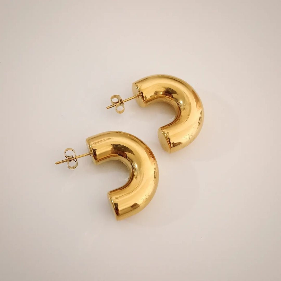 Aretes dorado reflejante