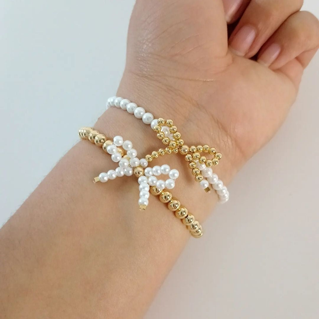 Pulseras moño en perla y dorado