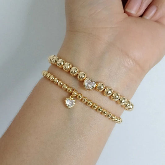 Pulsera dorada con corazon en zirconia