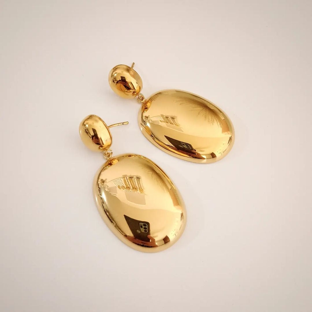 Aretes dorado reflejante