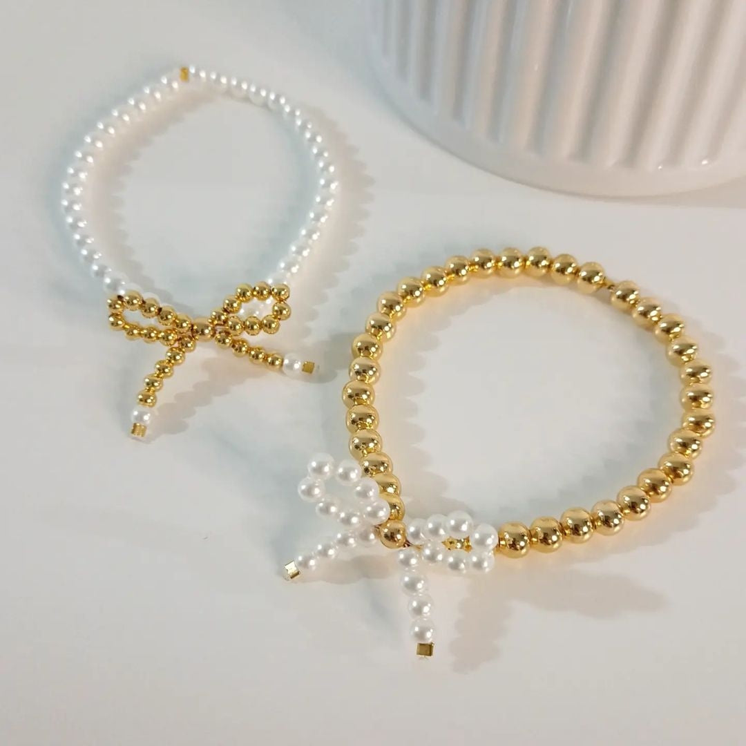 Pulseras moño en perla y dorado