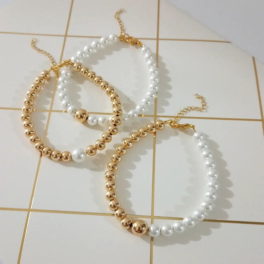 Pulseras combinadas dorado y perla