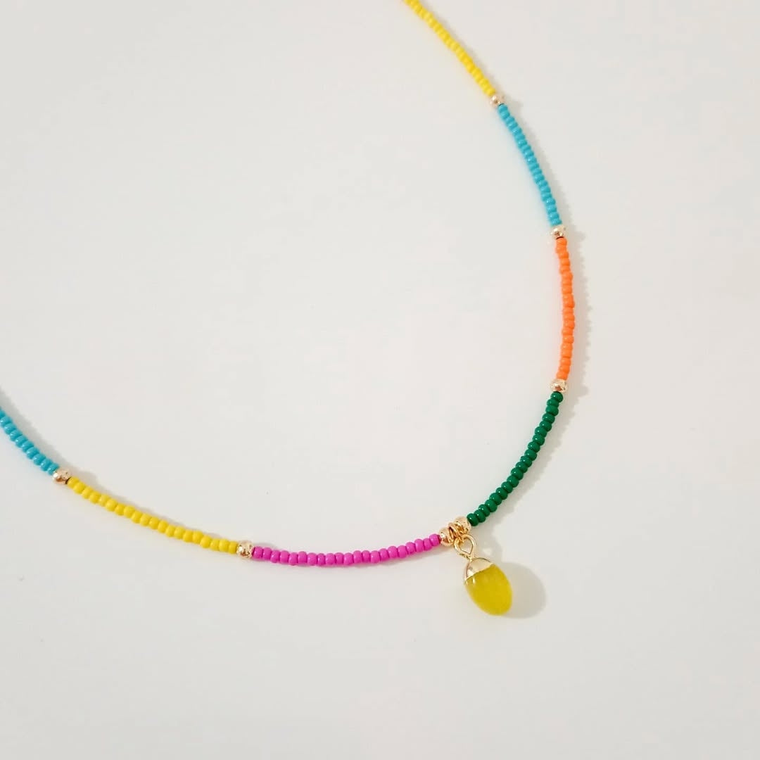Collar colores piedra amarilla, collar dorado piedra violeta y collar dije elefante (piezas por separado)