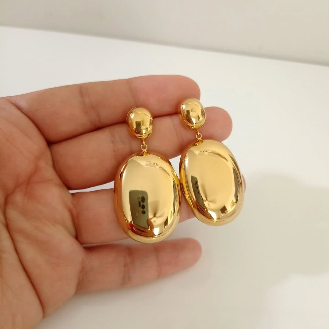 Aretes dorado reflejante