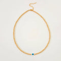 Collar dorado con ojito