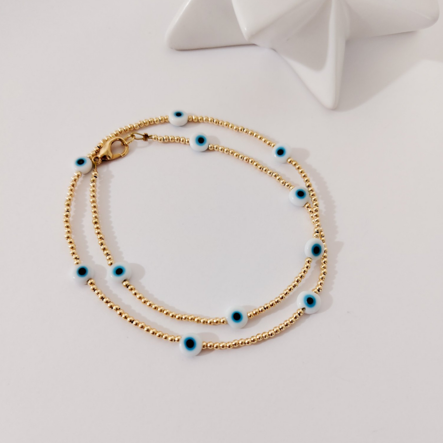 Collar dorado ojitos