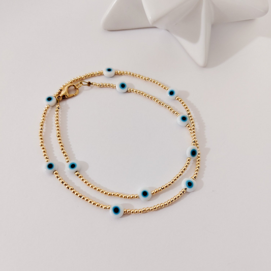 Collar dorado ojitos