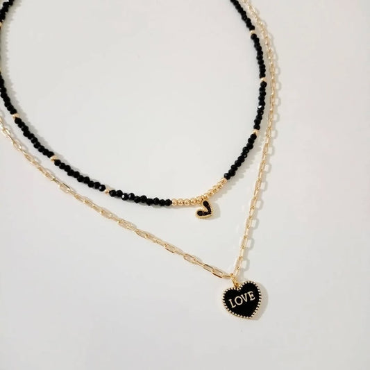 Collar cristal negro con dije corazón y collar dije corazon love (piezas por separado)