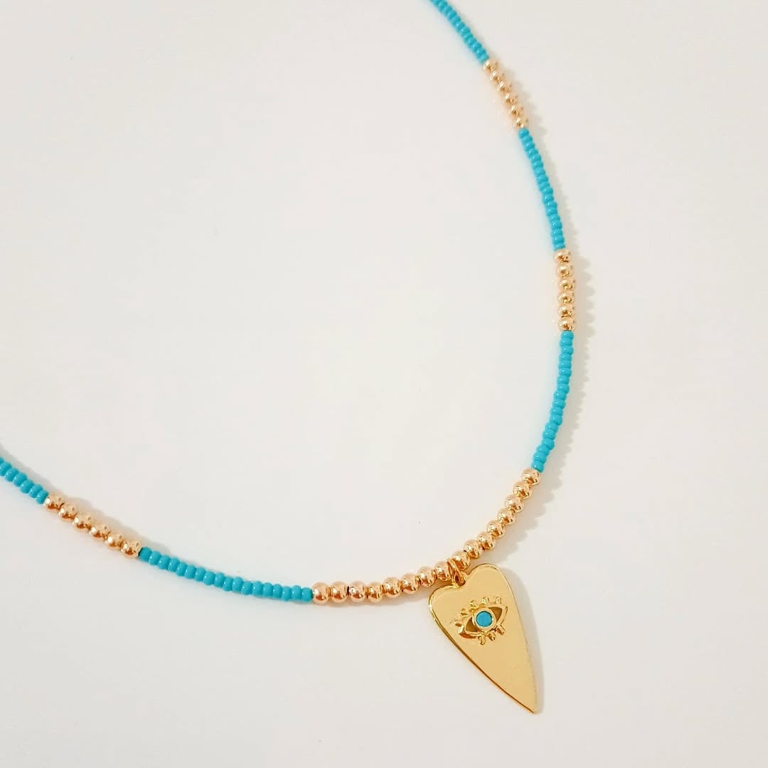 Choker ojitos, collar dorado corazón, collar azul corazón ojito y collar herradura (piezas por separado)