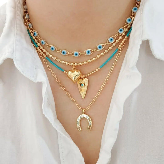 Choker ojitos, collar dorado corazón, collar azul corazón ojito y collar herradura (piezas por separado)