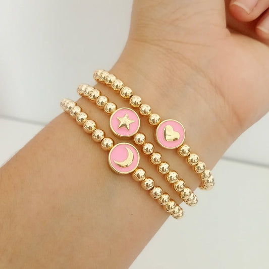 Pulsera puca colores con luneta rosa figura
